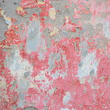 Old wall with red crumbling plaster