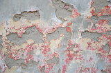 Old wall with crumbling plaster