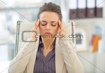 Stressed business woman in office