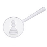 White pawn and magnifying glass