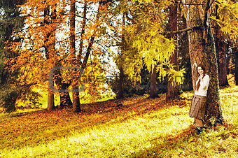 Girl in Autumn Forest