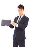 businessman holding a tablet to presenting