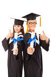 happy graduating students with thumb up