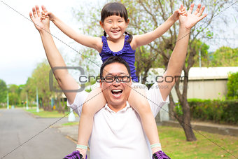 happy Father and little girl with sunset background