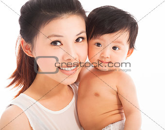 Happy  mother holding smiling child baby 