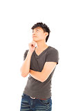 young man thinking or doubt on a white background