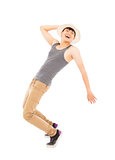 young man imitate  dancing pose and  holding a hat