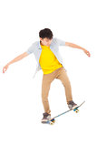 young man Skateboard to jump isolated on white background