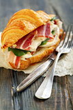 Sandwich with ham, brie cheese and salad.