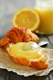Fresh croissant with lemon curd.