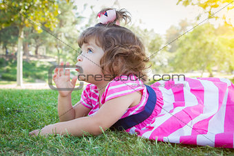 Cute Baby Girl Enjoying Lollipop Outdoors