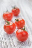 cherry tomatoes on white painted wood table