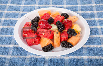 White Plate of Fresh Cut Fruit and Berries