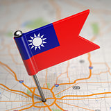 Taiwan Small Flag on a Map Background.