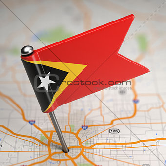 East Timor Small Flag on a Map Background.