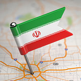 Iran Small Flag on a Map Background.