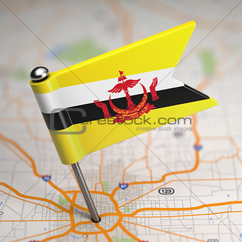 Brunei Small Flag on a Map Background.