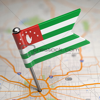 Abkhazia Small Flag on a Map Background.
