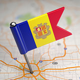 Andorra Small Flag on a Map Background.