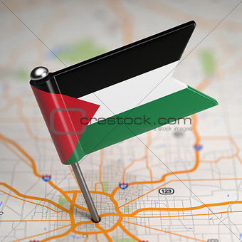 Palestine Small Flag on a Map Background.