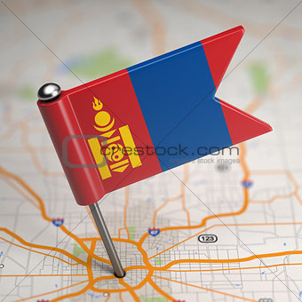 Mongolia Small Flag on a Map Background.