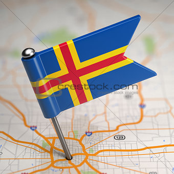 Aland Islands Small Flag on a Map Background.