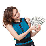 Portrait of pretty young woman holding a fan of dollar bills