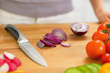 Closeup on onion slices on cutting board
