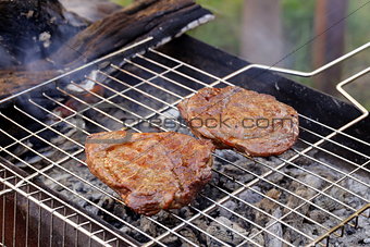 beef steak grilled on a barbecue outdoors