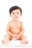 Infant child baby sitting on a white background