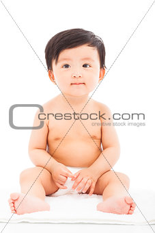Infant child baby sitting on a white background