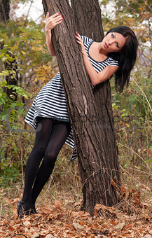 woman standing near a tree