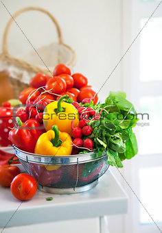 Fresh vegetables on table in kitchen