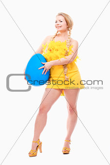 Young Woman with Long Blond Hair, Yellow Dress and Large Blue Eg