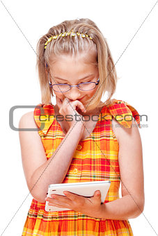 Portrait of a Little Girl with Glasses Holding Tablet 