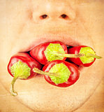 people with chile peppers in the mouth, paper texture