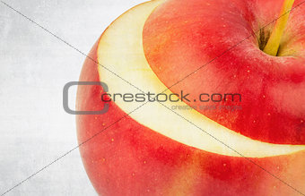 textured old paper background with fresh red apple