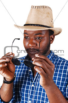 Black man with hat and glasses.
