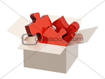 Parts of a puzzle in cardboard box