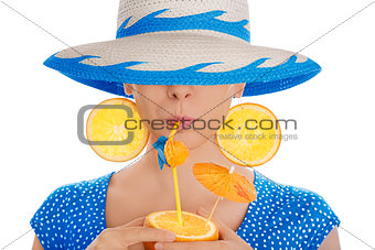 Girl with Orange Drink and Orange Slice Earrings Wearing Hat White Background