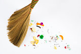 broom sweeping various debris