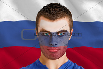 Serious young russia fan with facepaint