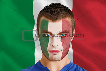 Serious young italy fan with facepaint