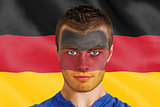 Serious young belgium fan with facepaint