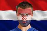 Serious young croatia fan with facepaint