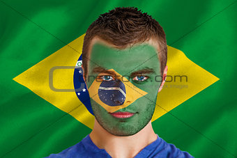 Serious young brasil fan with facepaint