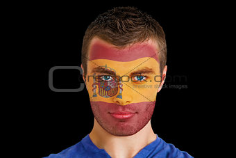 Serious young spain fan with facepaint