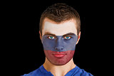Serious young russia fan with facepaint
