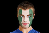 Serious young nigeria fan with facepaint