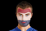 Serious young netherlands fan with facepaint